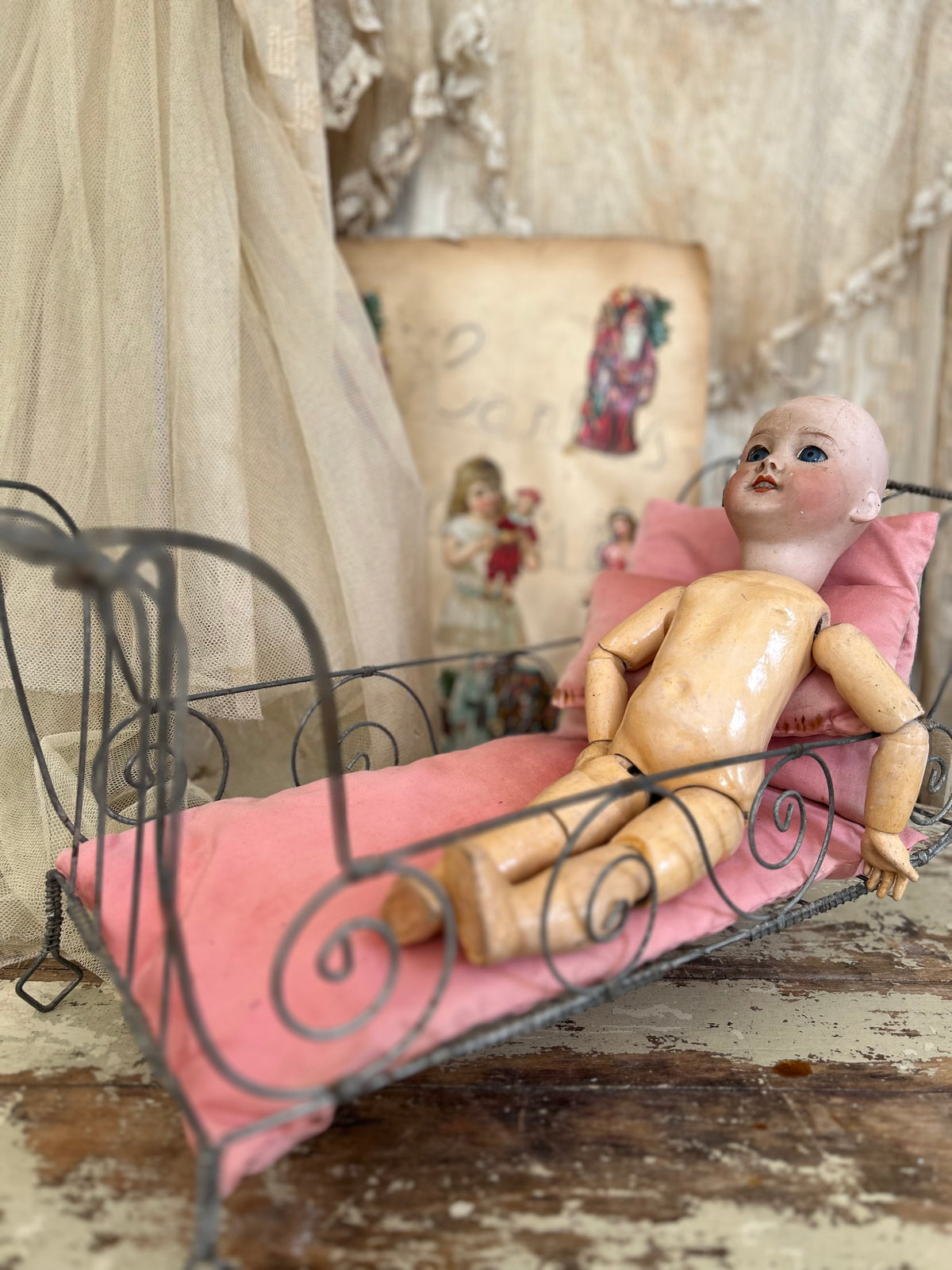 French antique doll bed with original mattress and pillows.