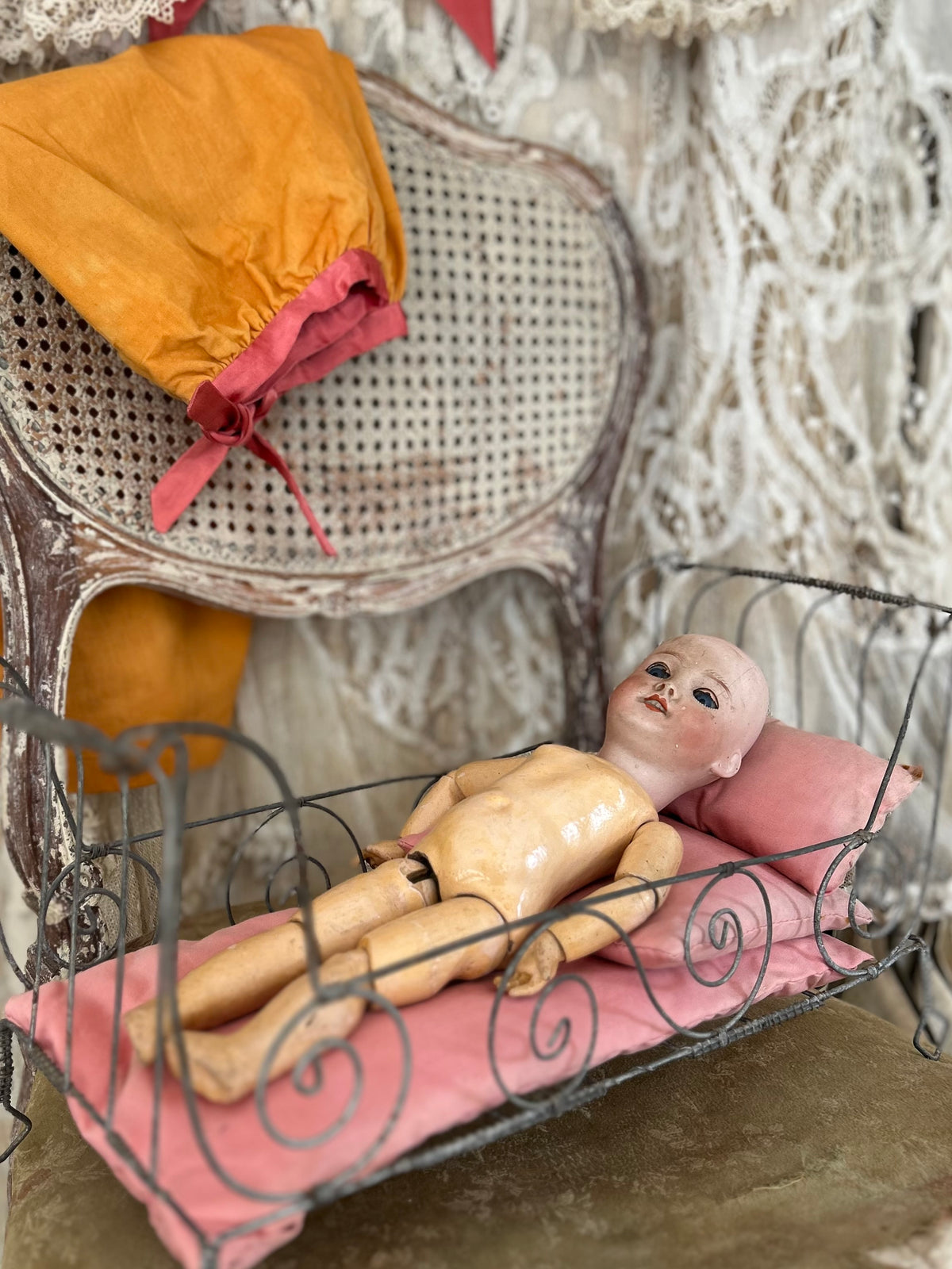 French antique doll bed with original mattress and pillows.