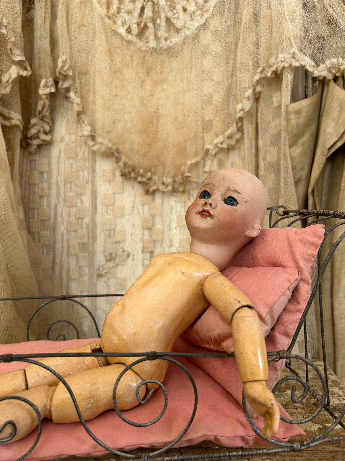 French antique doll bed with original mattress and pillows.