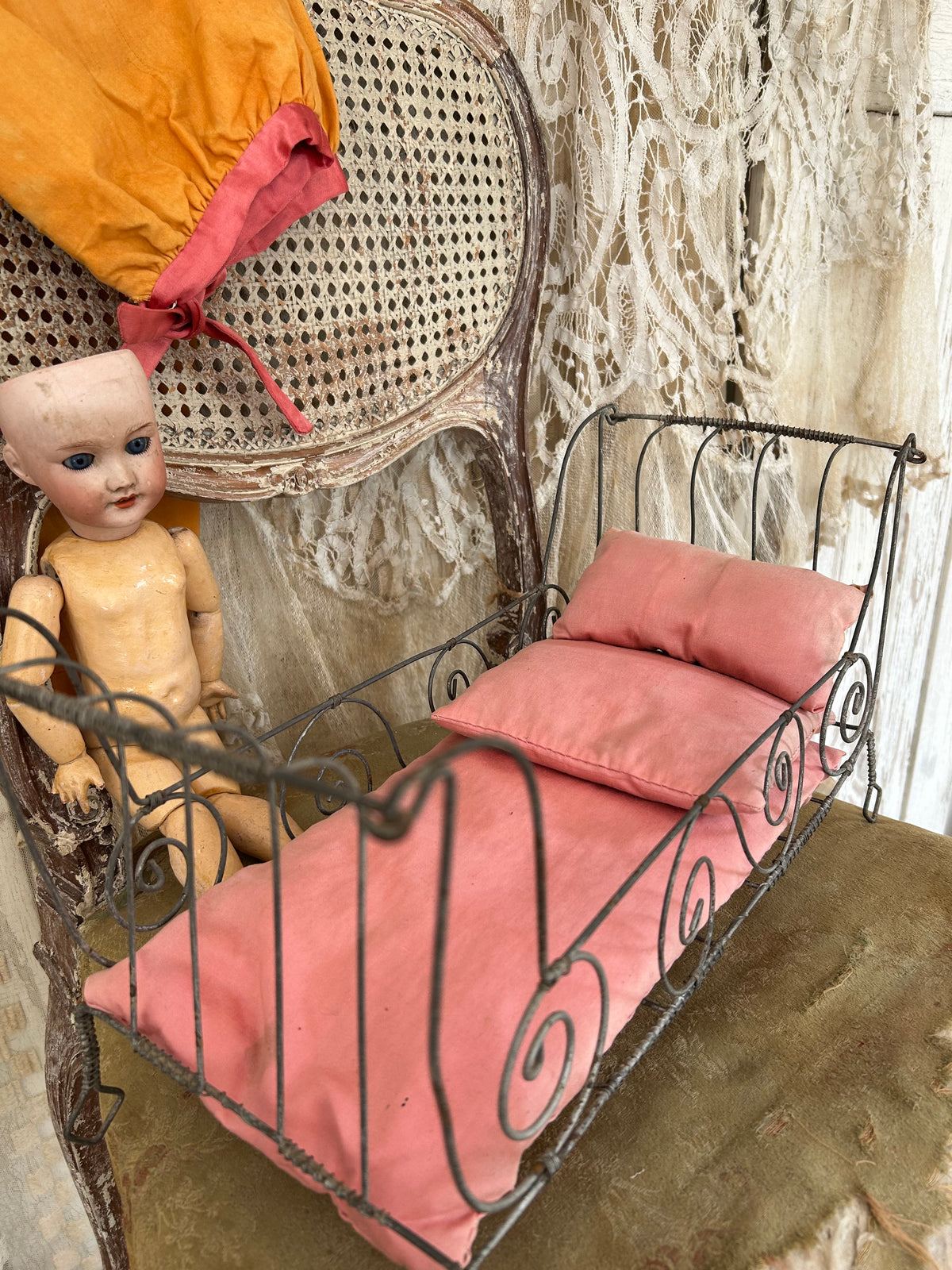 French antique doll bed with original mattress and pillows.