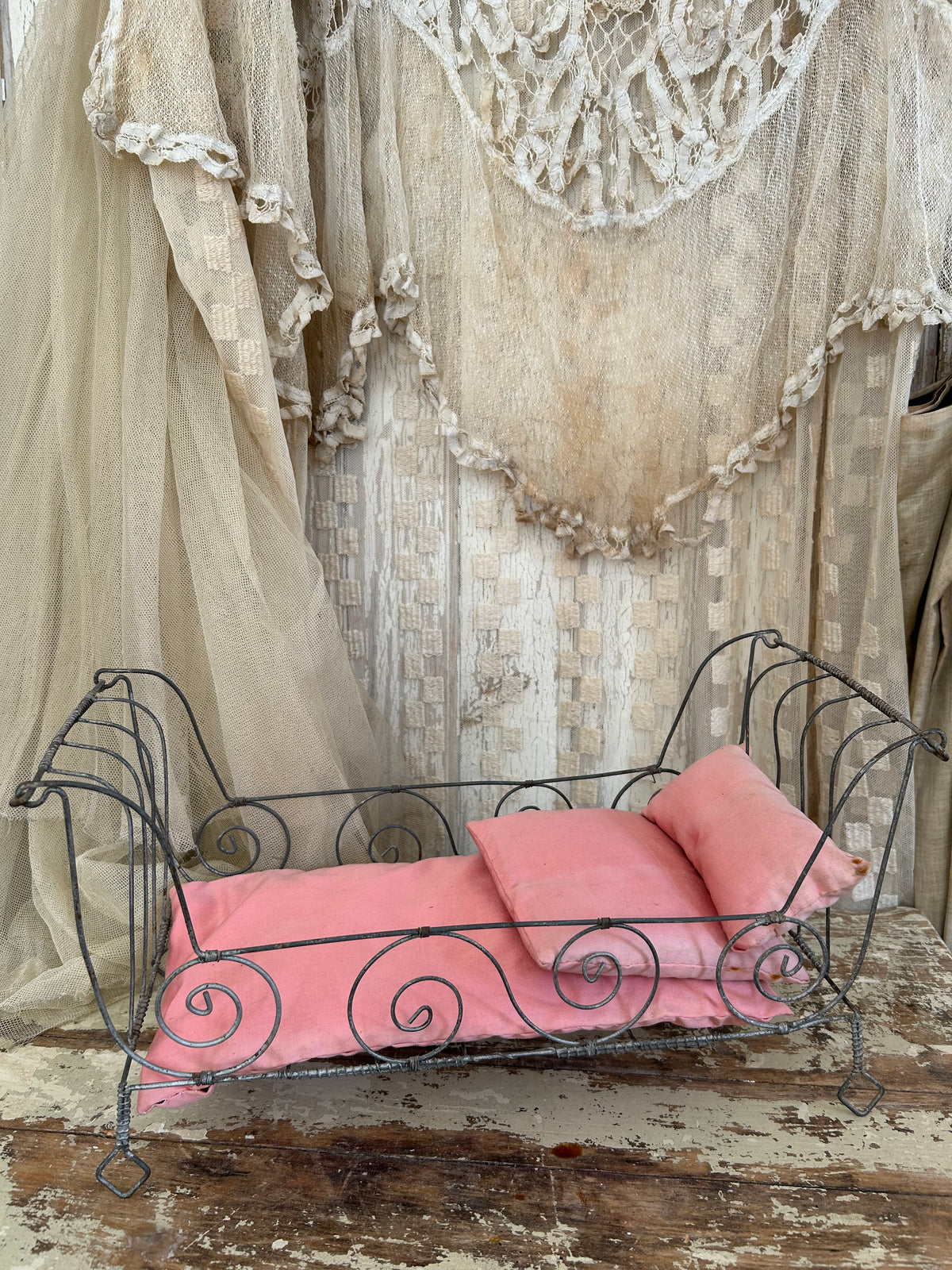 French antique doll bed with original mattress and pillows.